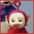 Pixelated character with large round eyes, red head, and dark blue body against light blue background.