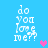 Pixelated text 'do you love me??' on blue background with animated heart symbols changing color and position.