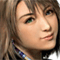 Pixelated close-up of a person with light brown hair and green eyes, wearing a blue patterned garment.