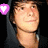 A person in a dark hooded garment with three distinct heart-shaped icons: purple, red, and green.