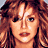 A 4-frame contact sheet of a pixelated animated icon showing a woman with long curly brown hair in a white top, displayed on a gray background.