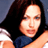 Static pixelated image of a person with long dark hair wearing a blue top, visible from shoulders up against a gradient background.