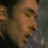 Two side-by-side animated frames of a man's face in profile view, showing subtle facial expression changes between the left and right frames.