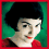 Pixelated of six showing a person with short dark hair against green background, red clothing visible; lower-left displays 'Amélie' text in red pixel font on black