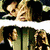 Animated sequence showing two people kissing, a heart symbol above them, and text reading 'LOVE' on one person's face.