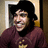 Pixelated image of a person in a maroon shirt and black hat with red text reading "If You Think I'm sexy Come And get my body!" on black background