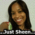 Pixelated image of a person with long dark hair smiling, wearing a black top and green striped sleeve, against light background with text "Just Sheen" at bottom.