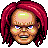 Pixelated character with red hair, light skin, blue eyes, and green accents on face and forehead.