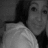 Black-and-white image of a person with long dark hair wearing a light-colored hoodie, shown in a of four with varying brightness and cropping