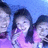 A four- with a pixelated photo of three people in the top-left, pink with text, and a gray