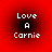 Four identical red circular icons with black gradients and white pixelated text reading "Love A Carnie" arranged in a