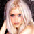 Static 50x50 pixel icon showing a close-up of a person with light-colored hair and blue eyes against dark background, rendered in low-resolution pixel art style.