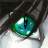 Pixelated close-up of a green and blue eye with dark eyelashes against a blurred background.
