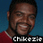 Pixelated image of a person with short dark hair wearing a red shirt against a blue background, with white text reading "Chikezie" at the bottom.