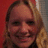 A static image with a blue background, pink text, and a photo of a smiling person with blonde hair.
