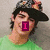 A person in a green shirt and dark cap with colorful accents appears across four , each showing different text overlays
