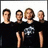 Four pixelated figures in black shirts stand side-by-side against a white background, with blue text on the right reading "say it if its worth saving me".