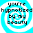 Four identical pixelated display a blue and white spiral background with black text reading "you're hypnotized by my beauty" in a retro digital font