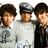 Group of six young men in two , some wearing gray caps and light shirts with dark symbols, others in black attire