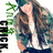 Pixelated image of a person with long brown hair wearing a white shirt and dark jacket, standing beside green text on the left.