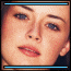 A pixelated close-up of a person's face with blue eyes and light skin, showing two side-by-side views where the top and bottom bars change from blue to white.