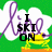 Green background with white cloud shapes and purple cursive text, featuring a yellow frog on an orange platform holding a black ski pole.