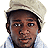 A pixelated image of a person wearing a light-colored cap and shirt, with blue text displaying '04.29 2005' above two horizontal bars.