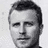 Black-and-white pixelated portrait of a man with short hair on left, cyan text 'Dierks Bentley Fan!' in blocky font on right against black background.