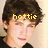 Pixelated close-up of a person with dark brown hair and light skin, wearing yellow text 'hottie' overlaid on the forehead against a beige background.
