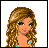 Pixelated cartoon woman with long wavy brown hair, green eyes, and a blue bikini top; text reads "-Beautiful- Beach -Babe-" on orange background.