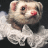 Pixelated static image of a ferret with light brown and white fur, pink inner ears, black eyes, red nose, and white fluffy cloud-like background on dark backdrop.