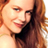 Pixelated close-up of a person with long brown hair wearing a black top, displayed as a static 48x48 buddy icon.