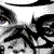 Black-and-white animated pattern of repeated stylized faces with exaggerated eyes and mouths, arranged in a -like composition