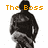 Pixelated image of a dark silhouette figure with arms crossed, overlaid by orange text reading "The Boss" against white background.