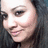 Pixelated close-up of a person's face with light skin, dark hair, and visible eye makeup including eyeliner.