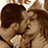 Static 48x48 pixel icon showing two people in a close embrace with sepia-toned coloring and heavy pixelation.