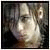 A pixelated image of a person with light hair and dark clothing, next to bold black text reading 'i miss you' on a white background.