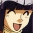 Pixelated anime-style character with dark hair and a cap, smiling widely with tongue out, next to text on black background.