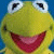 A 2x2 contact sheet of Kermit the Frog with pink text on cyan background, showing a static image across all frames.