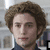six pixelated images showing a person with curly brown hair in various poses and expressions, each overlaid with text labels