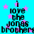 Pixelated text reads "i love the jonas brothers" on a cyan background with pink stars, repeated in four identical quadrants.