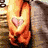 A heart-shaped icon with a pink outline and gray fill, featuring 'I <3 U' text in bright pink on black side