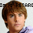 Pixelated image of a person with brown hair and light skin, wearing a blue shirt, against a white background with black text above the head.