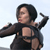 Pixelated figure in dark outfit with cutout details, arms extended in dynamic pose against light background.