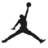 Black silhouette of a basketball player mid-jump with one arm extended upward holding a ball, legs spread wide apart on a white background.
