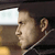 Pixelated close-up of a person's face in profile, showing ear, nose, and mouth against a blurred background with light and dark areas.