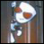Pixelated static icon of a white cartoon character with orange eyes and brown accents on a dark background, appearing to hold or interact with an object.