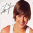 Pixelated image of a person with brown hair wearing an orange sleeveless top, smiling against a light background with faint gray shapes.