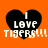 Four identical pixelated heart-shaped icons with black fill and white text on an orange background, each displaying "I LOVE TIGERS!!!" in a blocky font.