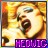 Pixelated image of a stylized face with warm yellow-orange tones and dark brown accents, featuring large eyes and an open mouth, set against a gradient background.